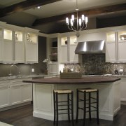 A view of the remodelled interior of this cabinetry, countertop, cuisine classique, flooring, interior design, kitchen, room, under cabinet lighting, gray, black