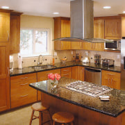 A view of a kitchen designed by NKBA cabinetry, countertop, cuisine classique, hardwood, home, interior design, kitchen, room, brown