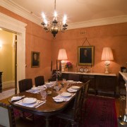 The formal room revolves around a large victorian dining room, interior design, restaurant, room, table, brown, orange, red