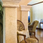 A view of some wallcoverings by WallCraft. - chair, column, floor, furniture, home, interior design, living room, room, structure, table, wall, wood, orange