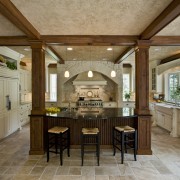 A view of a kitchen designed by Drury beam, cabinetry, ceiling, countertop, cuisine classique, dining room, estate, flooring, interior design, kitchen, real estate, room, wood flooring, brown, gray