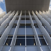 A view of the exterior of the greensquare architecture, building, commercial building, condominium, corporate headquarters, daylighting, daytime, facade, headquarters, landmark, line, metropolis, metropolitan area, sky, skyscraper, structure, symmetry, tower block, urban area, gray