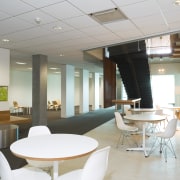 An interior view of the office building  architecture, ceiling, interior design, office, real estate, table, gray