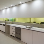 An interior view of the office building  cabinetry, countertop, interior design, kitchen, product design, gray