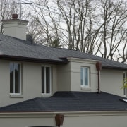 The Antique Black shingles on this house are building, daylighting, facade, home, house, outdoor structure, property, real estate, residential area, roof, siding, window, gray, black