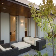 The outdoor pool and deck area is paved architecture, ceiling, courtyard, home, house, interior design, living room, real estate, wall, brown