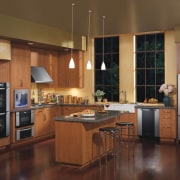 A view of this kitchen featuring the latetest cabinetry, countertop, cuisine classique, floor, flooring, hardwood, interior design, kitchen, room, wood flooring, brown