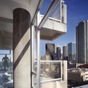 A view of an apartment complex developed by architecture, building, condominium, daylighting, interior design, gray, black