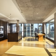 A view of an apartment complex developed by apartment, ceiling, floor, flooring, interior design, lobby, real estate, window, orange, brown