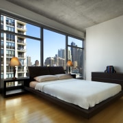 A view of an apartment complex developed by bed frame, ceiling, condominium, floor, furniture, interior design, loft, property, real estate, room, window, gray