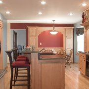 A view of this kitchen designed by Designer cabinetry, ceiling, countertop, cuisine classique, floor, flooring, hardwood, home, interior design, kitchen, real estate, room, wood flooring, orange, brown