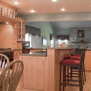 A view of this kitchen designed by Designer cabinetry, countertop, cuisine classique, floor, flooring, hardwood, home, interior design, kitchen, real estate, room, wood, wood flooring, orange