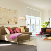 An interior view of the contemporary living areas couch, furniture, home, interior design, living room, real estate, room, table, gray