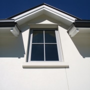 For this traditional-style home, Dunedin architect Mason &amp; architecture, building, daylighting, facade, home, house, property, roof, siding, sky, window, white, blue