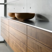 A view of this kitchen featuring Sleek contemporary chest of drawers, drawer, floor, furniture, interior design, plywood, product design, sideboard, wall, wood, wood stain, white