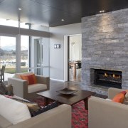 The stark contrasts of the Central Otago Climate fireplace, hearth, interior design, living room, real estate, room, gray