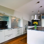 A view of this kitchen featuring the latest cabinetry, countertop, cuisine classique, interior design, kitchen, real estate, room, gray