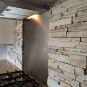 This splashback may look like it was chipped floor, wall, gray