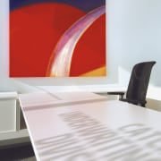 Interior view of Lloyd's Reinsurance Co. featuring stone floor, furniture, interior design, product design, table, wall, white