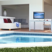 An interior view of these living areas featuring floor, furniture, property, real estate, swimming pool, table, white