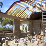 The rumpas room was small and lacked natural outdoor structure, pergola, real estate, roof, brown