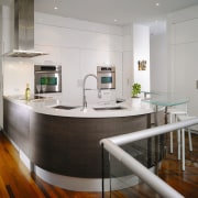 A view of the kitchen area, wooden flooring countertop, floor, interior design, kitchen, table, gray