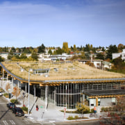 View of the Ballard Library and Neighborhood Service city, construction, home, real estate, residential area, roof, sky, suburb, urban area, teal