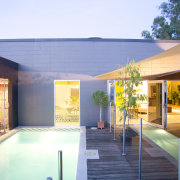 French doors lead directly from the main living architecture, estate, home, house, leisure, property, real estate, swimming pool, villa, teal