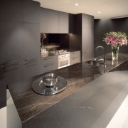 Kitchens are deigned with marble benchtops and cainetry countertop, floor, flooring, interior design, kitchen, gray, black