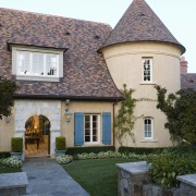 View of house, clay tile roof, cement plaster building, cottage, estate, facade, home, house, mansion, property, real estate, roof, sky, villa, window, gray, white