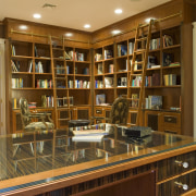 Custom Design Cabinets designed and fabricated the cabinets bookcase, bookselling, cabinetry, furniture, institution, library, library science, liquor store, public library, shelf, shelving, brown, orange
