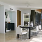 A view of the dining area featuring black floor, flooring, interior design, real estate, room, gray