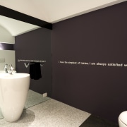 This minimalist powder room provides some celebrated words bathroom, floor, interior design, plumbing fixture, product design, property, room, black, white