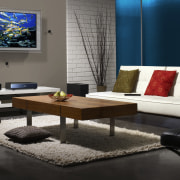 A view of a home theatre system from coffee table, couch, furniture, home, interior design, living room, room, table, gray, black