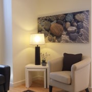 Every square metre of the apartments is designed floor, flooring, furniture, home, interior design, living room, room, table, wall, orange