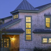 Exterior view of the house, shingle siding, shinlge architecture, building, cottage, estate, evening, facade, home, house, lighting, real estate, residential area, roof, siding, sky, window, blue