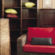 A view of this Samarang furniture that features couch, flooring, furniture, interior design, living room, room, table, wall, wood, black