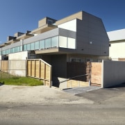 Clean-lined facades offer a chic, modern feel to architecture, building, commercial building, elevation, facade, home, house, property, real estate, residential area, gray