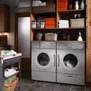 A view of this niche built in laundry cabinetry, clothes dryer, furniture, home appliance, laundry, laundry room, major appliance, room, washing machine, black, gray