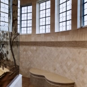 A view of this octagon shaped bathroom designed bathroom, estate, floor, flooring, interior design, property, room, tile, wall, window, brown