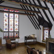 View of the main lounge featuring rafters, wooden ceiling, daylighting, interior design, tourist attraction, window, black, gray
