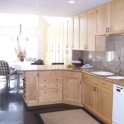 View of a renovated kitchen and dining area cabinetry, countertop, cuisine classique, floor, flooring, hardwood, home, interior design, kitchen, property, real estate, room, white