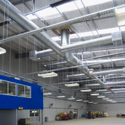 Fans in the main building are controlled via aerospace engineering, airport terminal, daylighting, engineering, factory, industry, manufacturing, steel, structure, gray