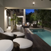 A view of the pool from the indoor architecture, estate, home, house, interior design, lighting, property, real estate, resort, swimming pool, window, black, gray