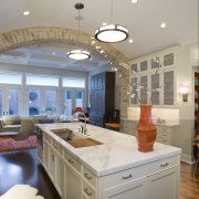 View of kitchen featuring wooden floor, cabinetry, marble ceiling, countertop, home, interior design, kitchen, living room, real estate, room, window, gray