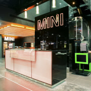 The LED-lit exterior frames are synchronised with the glass, interior design, retail, black