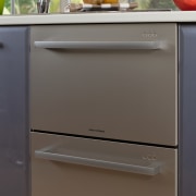 A view of some kitchen appliances from Fisher chest of drawers, drawer, furniture, gas stove, home appliance, kitchen, kitchen appliance, kitchen stove, major appliance, refrigerator, gray