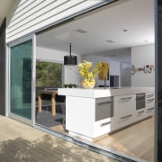 A view of some door and window joinery architecture, countertop, daylighting, floor, house, interior design, kitchen, real estate, window, gray, white