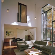 Floor-to-ceiling glazing on the eastern side of the architecture, ceiling, daylighting, furniture, home, house, interior design, living room, table, gray, brown