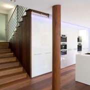 View of kitchen design by Linda Haefeli, and door, floor, flooring, hardwood, interior design, real estate, wood, wood flooring, white, brown